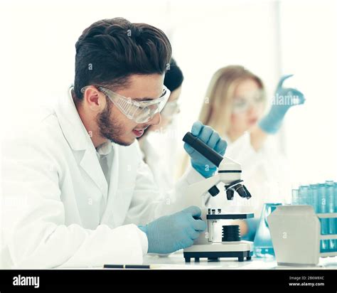 Close Upmale Scientist Conducting Research In The Laboratory Stock