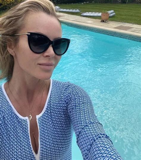 Amanda Holden Flaunts Cleavage In Daringly Plunging Swimsuit For Dip In