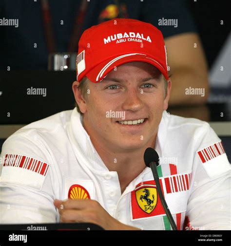 Finnish Formula One Driver Kimi Raikkonen Of Ferrari Laughs During A