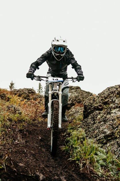 Premium Photo Athlete Rider Downhill On Dirty Trail In Autumn