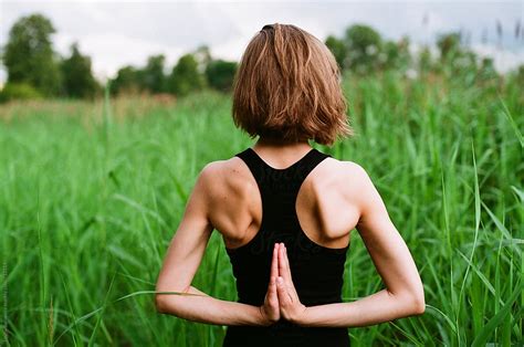 Woman Doing Yoga Outdoors Del Colaborador De Stocksy Amor Burakova