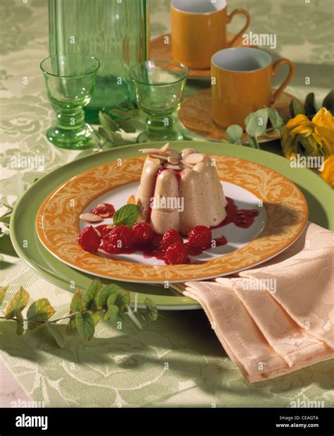 Bourbon Vanilla Pudding With Hot Raspberries Stock Photo Alamy