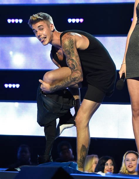 Justin Bieber Shirtless During Fashion Rocks Photos Popsugar Celebrity Photo 10