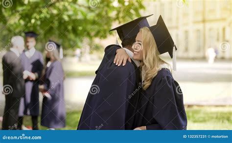 Classmates in Graduation Outfit Talking, Hugging and Congratulating ...