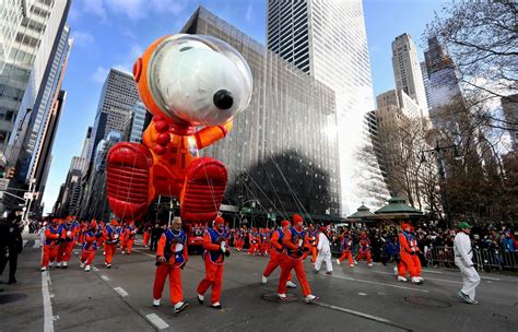 The Snoopy The Astronaut Balloon Makes Its Way Down 6th Ave In Manhattan During The Annual Macy