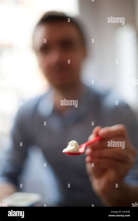 Person Holding Out Spoonful Food Hi Res Stock Photography And Images