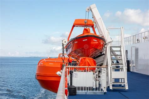 Bright Orange Rescue Boats on a Deck of a Ferry To Save Lives Stock Photo - Image of loading ...