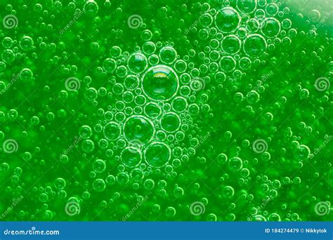 Abstract Liquid Soap Bubbles Green Background Stock Image | CartoonDealer.com #184274479