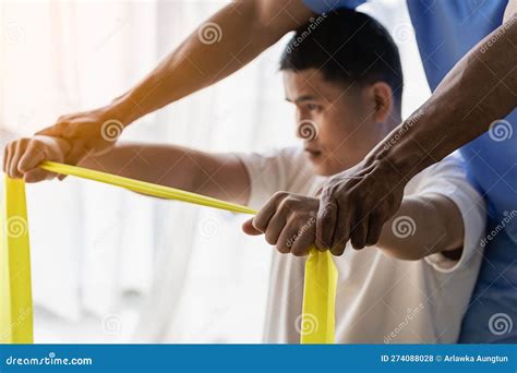 Male Chiropractor Physiotherapist Or Orthopedist Examining A Patient