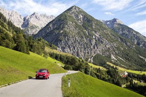 Gramais Austria 12 September 2015 Red Car Driving On Alpine Road