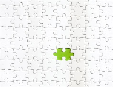 Premium Photo | Missing piece of puzzle with a green color as background