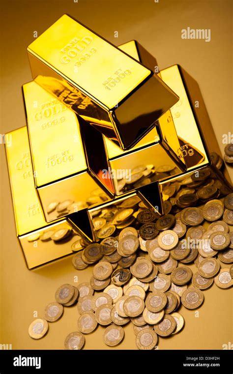 Gold bullion with coins Stock Photo - Alamy