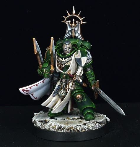 A Green And White Painted Warhammer With Two Swords