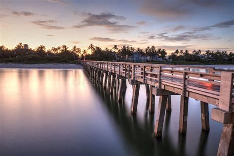 Early Sunrise Over the Naples Pier on the Gulf Coast of Naples, Stock ...