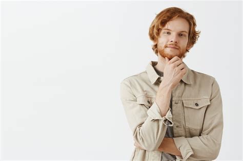 Free Photo Thoughtful And Intrigued Bearded Redhead Guy Posing