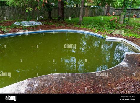 Abandoned And Filthy Swimming Pool In Disrepair Stock Photo Alamy