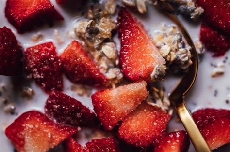 Premium Photo Close Up Of Cut Strawberries With Sugar Granules And