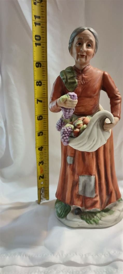 Flambro Porcelain Figurines Old Woman With Apron Of Fruit And