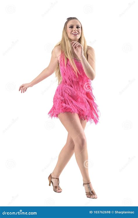 Blonde Female Latino Dancer Smiling Joyful And Dancing Salsa Stock