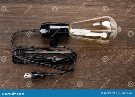 Incandescent Light Bulb and Cord Stock Photo - Image of socket, wood ...