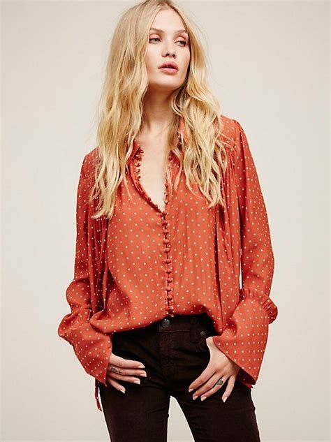 In An Oversized And Flowy Shape This Semi Sheer Buttondown Blouse Is