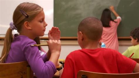 Students Whispering In Class