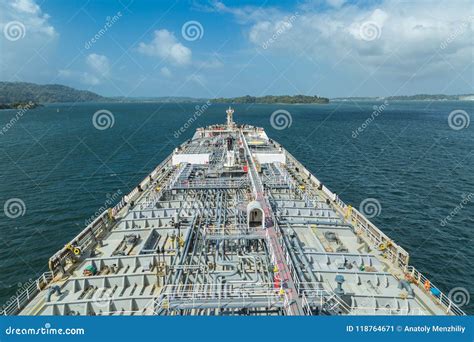 Oil Tanker Proceeding Through Panama Canal By Green Jungle Stock Image