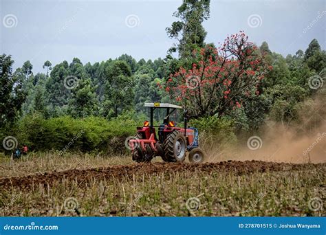 Farm Tractor Ploughing A Dusty Field Editorial Image Image Of Track