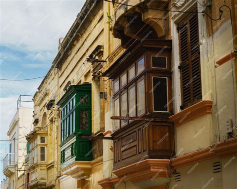 Premium Photo | Brown green yellow traditional maltese balconies yellow