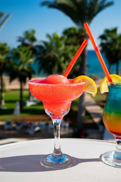 Colourful Cold Strawberry Daiquiri And Rainbow Paradise Cocktails