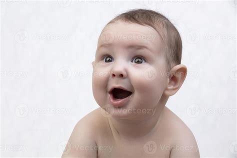 Surprised child's face. Portrait of a newborn baby with a funny shocked ...