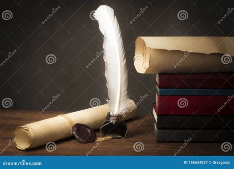 Papyrus Scrolls On A Table Top With Books Pen And Inkwell Stock Image