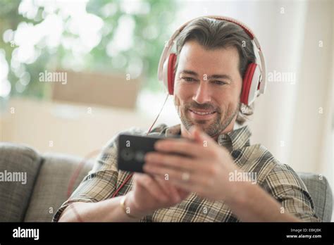 Smiling Man Listening To Music Stock Photo Alamy