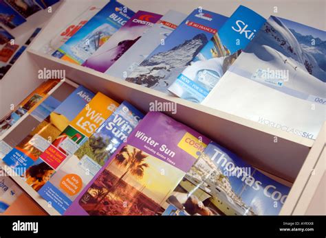 Travel Brochures On Display At Travel Agency Britain Uk Stock Photo