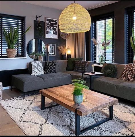 A Living Room Filled With Furniture And Large Windows