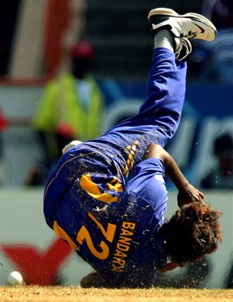 Malinga Bandara dives to make a neat stop off his own bowling ...