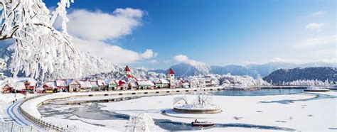 A Snow Covered Landscape With Trees And Buildings