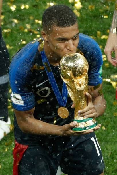 France S Forward Kylian Mbappe Kisses The Trophy As He Celebrates Artofit