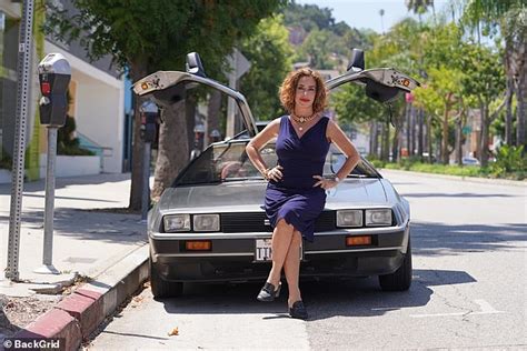 Back To The Future star Claudia Wells poses with a DeLorean 35 years after starring in the film ...