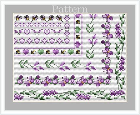 A Cross Stitch Pattern With Purple Flowers