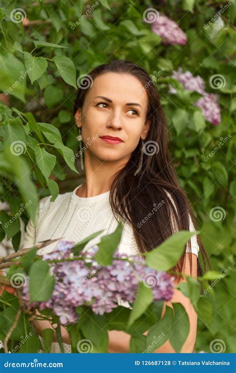 Portrait Of A Young Dreamy Woman In A White Vintage Knitted Dress In