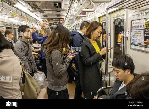 commuters on Kyoto metro Stock Photo - Alamy