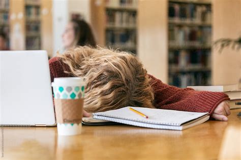 Female College Student Falls Asleep In Library By Stocksy Contributor