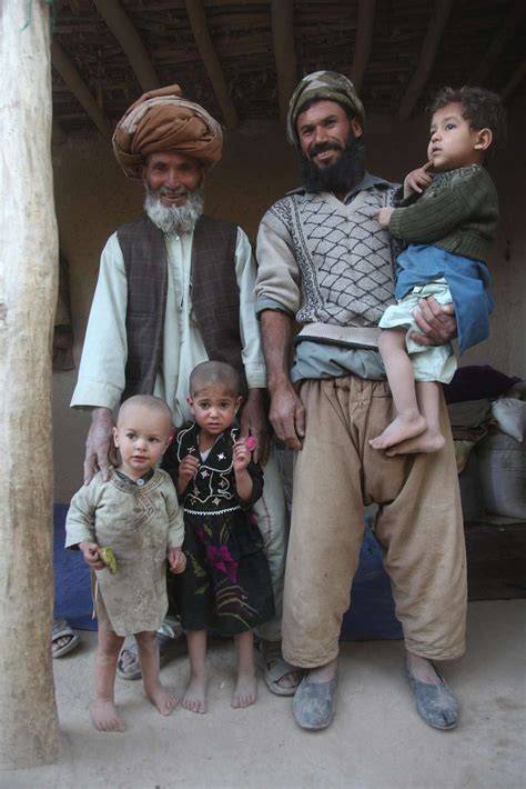 An Afghan family pose for a photo while Afghan National - NARA & DVIDS ...