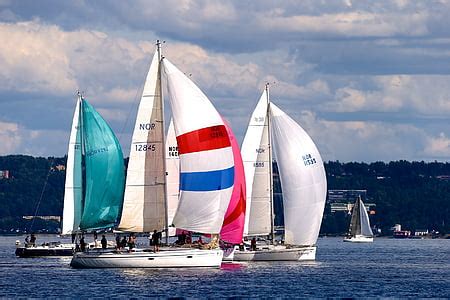 Royalty Free Photo Sailing Boat On Body Of Water Near Highrise