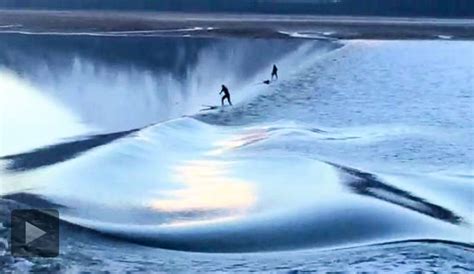 Paddleboarders Surf Alaskan Bore Tide Along Turnagain Arm | The Inertia