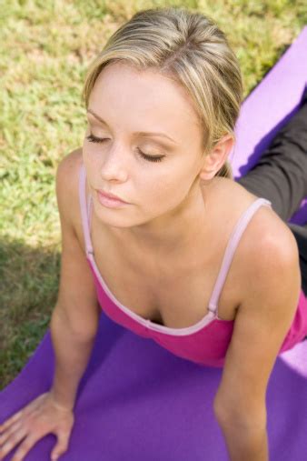 Pretty Young Caucasian Women With Eyes Closed Doing Back Stretches