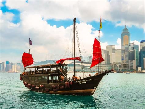 Traditional Junk Sailboat With Red Sails In The Victoria Harbor Hong