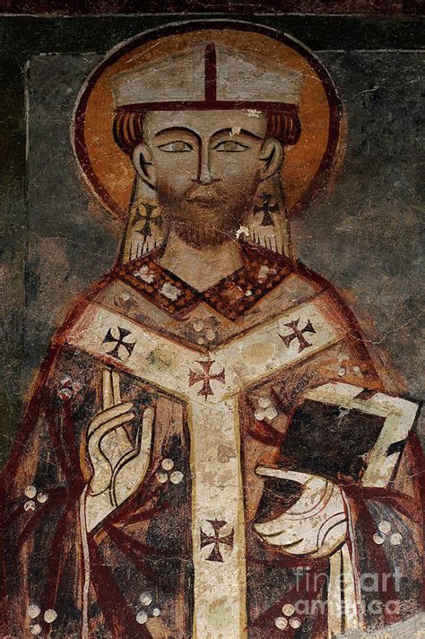 Bishop Cradles Bible In Left Arm And Raises Right Hand In Blessing In