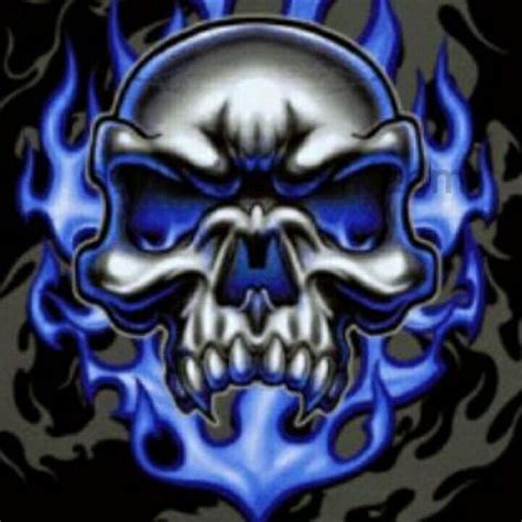 A Blue And Black Skull With Flames On It